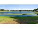 Scenic backyard with a tranquil lake view, perfect for enjoying nature and outdoor activities at 829 Lakeworth Cir, Lake Mary, FL 32746