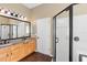 Bathroom featuring double vanity with granite countertops, a shower and a soaking tub at 829 Lakeworth Cir, Lake Mary, FL 32746