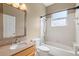 Bathroom features granite countertop vanity, shower over tub and a window for natural light at 829 Lakeworth Cir, Lake Mary, FL 32746