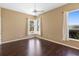Cozy bedroom with hardwood floors, neutral paint, and double windows at 829 Lakeworth Cir, Lake Mary, FL 32746
