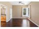 Bright bedroom with hardwood floors and natural light from large windows at 829 Lakeworth Cir, Lake Mary, FL 32746
