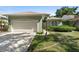 Charming single-story home featuring a well-manicured lawn and attached two-car garage at 829 Lakeworth Cir, Lake Mary, FL 32746