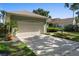 The two car garage has driveway parking and a beautifully landscaped front yard at 829 Lakeworth Cir, Lake Mary, FL 32746