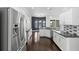 A spacious kitchen with stainless steel appliances, granite countertops, and white cabinetry at 829 Lakeworth Cir, Lake Mary, FL 32746