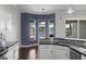 Kitchen features white cabinets, stainless steel appliances, and a mosaic tile backsplash at 829 Lakeworth Cir, Lake Mary, FL 32746