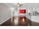 Spacious living room with dark wood floors and large windows for natural light at 829 Lakeworth Cir, Lake Mary, FL 32746