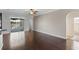 Open living room with hardwood floors, large sliding glass doors, and neutral paint at 829 Lakeworth Cir, Lake Mary, FL 32746