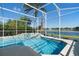 Bask in the sun by the screened-in pool and spa with stunning lake views in your private backyard at 829 Lakeworth Cir, Lake Mary, FL 32746