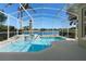 Relax in the screened-in pool and spa while taking in the tranquil views of the surrounding lake at 829 Lakeworth Cir, Lake Mary, FL 32746