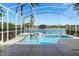 Enjoy the outdoors in the screened-in pool area featuring a jacuzzi and waterfront views at 829 Lakeworth Cir, Lake Mary, FL 32746