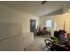 Spacious garage featuring tile flooring, white walls, and ample storage space for vehicles and equipment at 890 Emerald Dr, Mount Dora, FL 32757