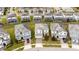 Aerial view showcasing homes in a neatly planned neighborhood with screened pools at 9034 Stinger Dr, Davenport, FL 33896