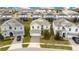 Aerial shot of a home with a well-manicured lawn and neighborhood at 9034 Stinger Dr, Davenport, FL 33896