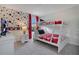 Charming bedroom featuring Mickey Mouse themed decor and a bunk bed, perfect for  at 9034 Stinger Dr, Davenport, FL 33896