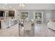 Dining area features modern decor, stylish lighting, and seamless flow into the kitchen at 9034 Stinger Dr, Davenport, FL 33896