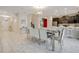 Dining area features modern decor, stylish lighting, and seamless flow into the kitchen at 9034 Stinger Dr, Davenport, FL 33896