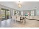 Dining area features modern decor, stylish lighting, and seamless flow into the living room at 9034 Stinger Dr, Davenport, FL 33896