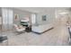 Bright living room features tile floors, modern decor, and comfortable seating arrangement at 9034 Stinger Dr, Davenport, FL 33896