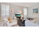 Bright living room features tile floors, modern decor, and comfortable seating arrangement at 9034 Stinger Dr, Davenport, FL 33896