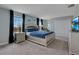 Bright main bedroom featuring a king bed, nightstands, and a large closet with ample storage at 9034 Stinger Dr, Davenport, FL 33896