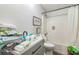 Bright bathroom featuring shower over tub with white tiling, and gray vanity sink at 10585 Sw 38Th Ave, Ocala, FL 34476