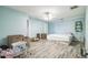 Spacious bedroom with light blue walls and tile floors, partially filled with boxes at 10585 Sw 38Th Ave, Ocala, FL 34476