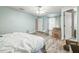 Bedroom with light blue walls, tile floors, closet, and bed at 10585 Sw 38Th Ave, Ocala, FL 34476