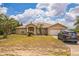Charming single-Gathering home featuring a two-car garage and a well-manicured lawn at 10585 Sw 38Th Ave, Ocala, FL 34476