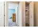 Hallway with a view into a blue-walled bedroom and an open closet on the right at 10585 Sw 38Th Ave, Ocala, FL 34476