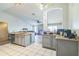 Bright, open-concept kitchen with granite counters and stainless steel appliances at 10585 Sw 38Th Ave, Ocala, FL 34476