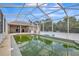 Screened pool area with blue tile accents and view of home exterior with patio at 10585 Sw 38Th Ave, Ocala, FL 34476