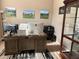 Home office featuring a large wood desk, wall decor, and natural light at 11120 Se 168Th Loop, Summerfield, FL 34491