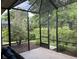A screened patio offers views of lush landscaping and provides a private outdoor retreat at 11120 Se 168Th Loop, Summerfield, FL 34491
