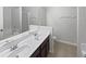 Bathroom with dual vanity sinks, and a combined shower and bathtub at 1123 Hacienda Cir, Kissimmee, FL 34741