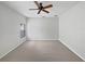 A bright bedroom with soft gray carpet and one window with natural light at 1123 Hacienda Cir, Kissimmee, FL 34741