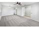 Large living room featuring carpet, ceiling fan, and neutral color palette at 1123 Hacienda Cir, Kissimmee, FL 34741