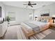 Serene main bedroom features a neutral color palette, soft rug, and ample natural light at 1123 Hacienda Cir, Kissimmee, FL 34741