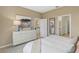 This bedroom shows a dresser, decor, and a doorway with views into other rooms of the house at 1219 Normandy Dr, Haines City, FL 33844