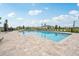 Beautiful community pool area with lounge chairs, a splash area, and well-maintained deck at 1219 Normandy Dr, Haines City, FL 33844