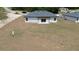 New construction home with pergola, patio, and newly laid sod at 13253 Sw 83Rd Cir, Ocala, FL 34473