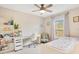 Cheerful bedroom with desk, window, and decorative string lights at 13622 Cygnus Dr, Orlando, FL 32828