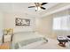 Bright bedroom with modern white bed frame, side tables, and cozy decor at 13622 Cygnus Dr, Orlando, FL 32828