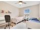 Shared bedroom with two twin beds, desk, and ample natural light at 13622 Cygnus Dr, Orlando, FL 32828