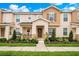 Charming townhome with a well-manicured lawn and inviting front porch at 13622 Cygnus Dr, Orlando, FL 32828