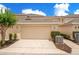 Charming townhome with a two-car garage and well-maintained landscaping at 13622 Cygnus Dr, Orlando, FL 32828