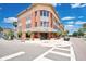 Modern commercial building with sushi restaurant and ample windows under a blue sky at 13622 Cygnus Dr, Orlando, FL 32828