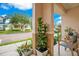 Cozy front porch featuring stylish seating and potted plants, offering a relaxing outdoor space at 13622 Cygnus Dr, Orlando, FL 32828