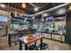 Bowigens interior view with bar, high tables, TV screens and modern design elements at 13622 Cygnus Dr, Orlando, FL 32828