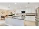 Bright kitchen with stainless steel appliances and a large island perfect for cooking at 13622 Cygnus Dr, Orlando, FL 32828