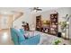 Comfortable living room with a ceiling fan and plenty of natural light at 13622 Cygnus Dr, Orlando, FL 32828